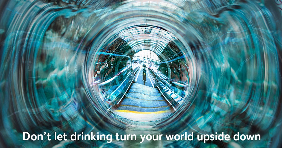 Revellers warned to “keep a clear head” around the rail network over the festive season: Don't let drinking turn your world upside down poster