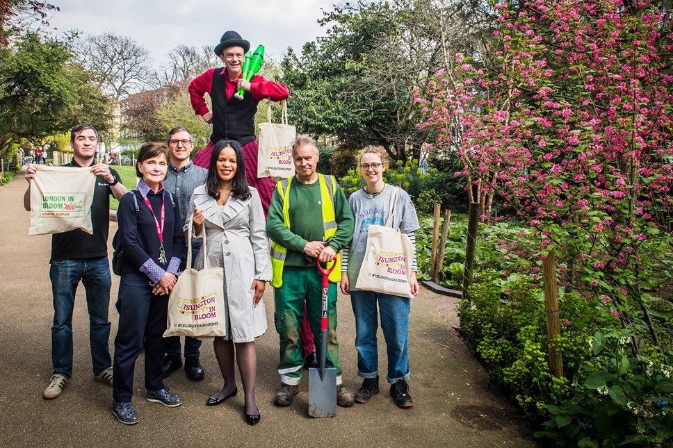 Launch of Islington In Bloom 2019 at Duncan Terrace Gardens - members of Friends of Duncan Terrace join council parks staff, Cllr Claudia Webbe, executive member for environment and transport and Jebb the Jester (on stilts)