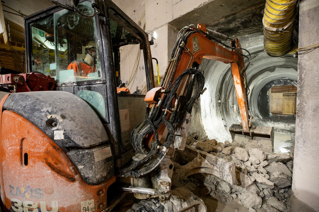 Excavator at work during the construction of a cross passage for the chiltern tunnel