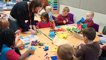 Children working on making banners at school