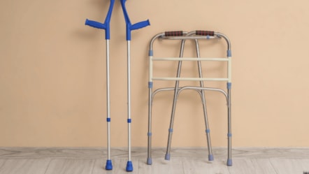A pair of crutches and a walking frame