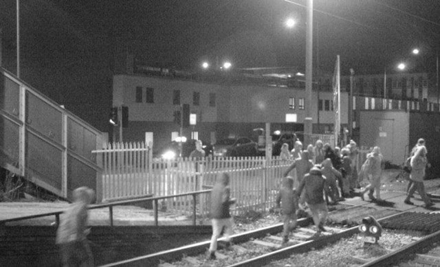 School children across Norfolk, Suffolk, Essex and Cambridgeshire warned to keep off the tracks and tune into railway safety lessons at home: People on the tracks at Grays level crossing in Essex