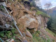 A large area of overhanging and fractured rock was exposed by a landslide.: A large area of overhanging and fractured rock was exposed by a landslide.