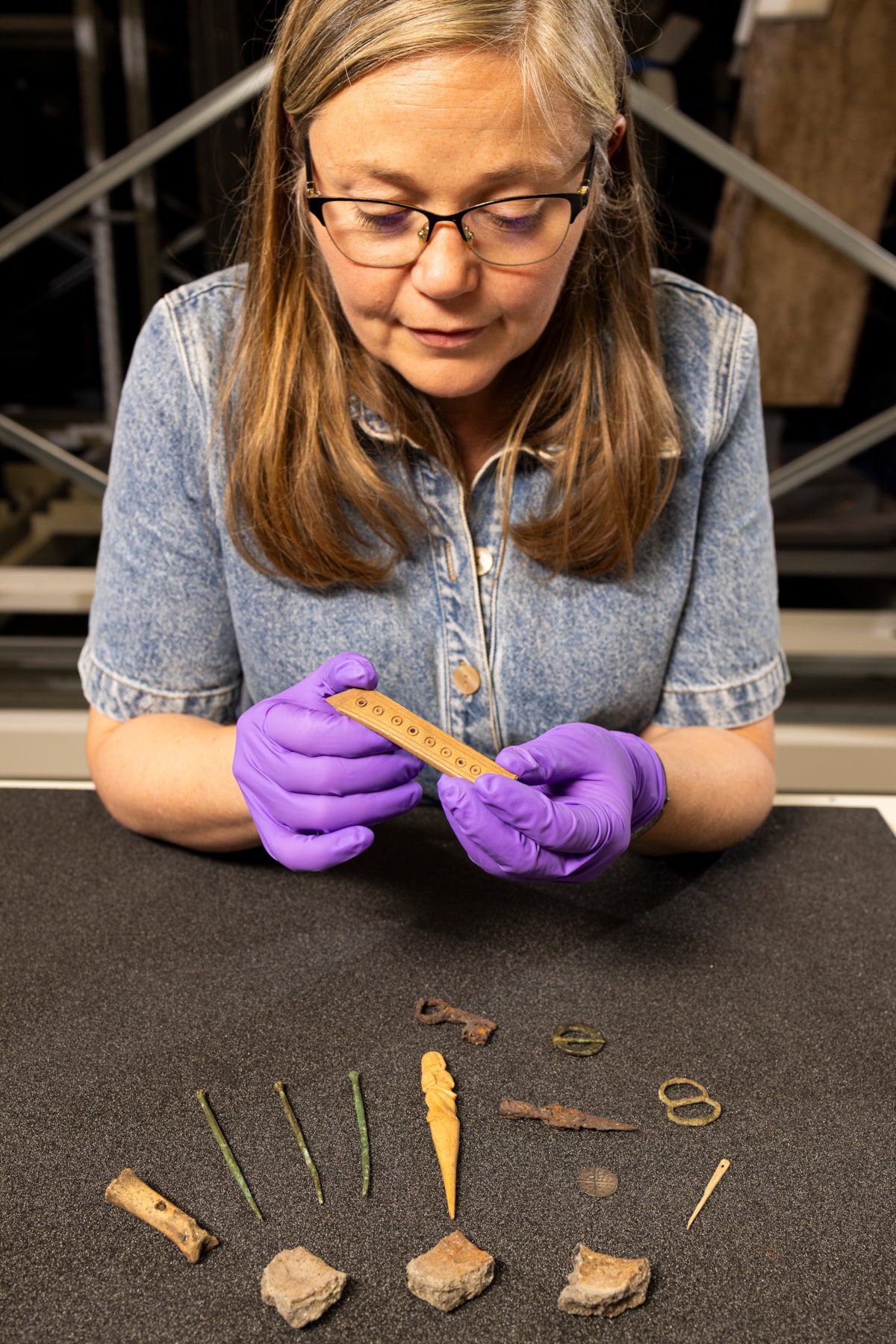 Dr Alice Blackwell with a selection of objects from the Eilean Donan assemblage - copyright Duncan McGlynn