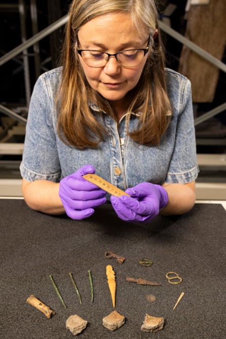 Dr Alice Blackwell with a selection of objects from the Eilean Donan assemblage - copyright Duncan McGlynn