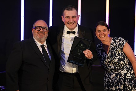 Image shows Alfie Lamb collecting his Rising Star award at the Finance Awards North West