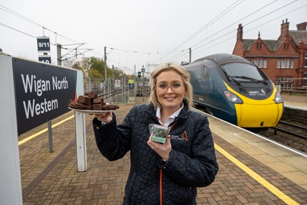Avanti West Coast Train Manager, Helen May, with Uncle Joe's Mint Balls Brownie