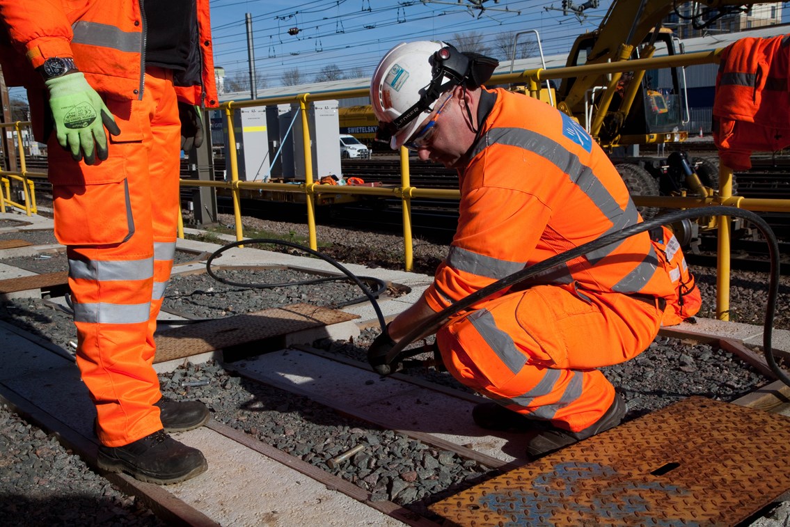 Engineer fitting new cables as part of the East Coast Digital Programme