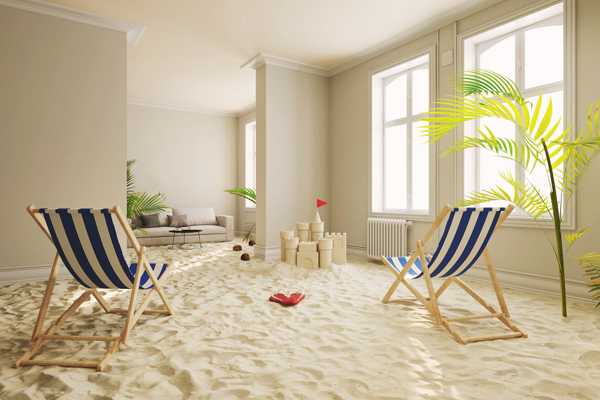 two deckchairs in a sandy home