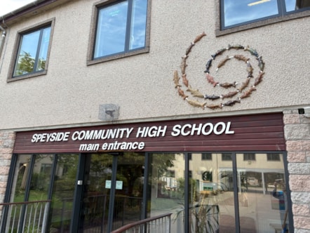 Main entrance of Speyside High School, showing the school signage and exterior building