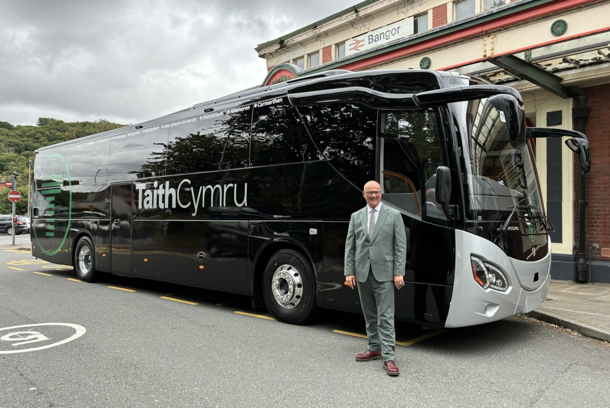 Deputy Minister for Transport Mark Hooper with a new TaithCymru coach in Bangor-2