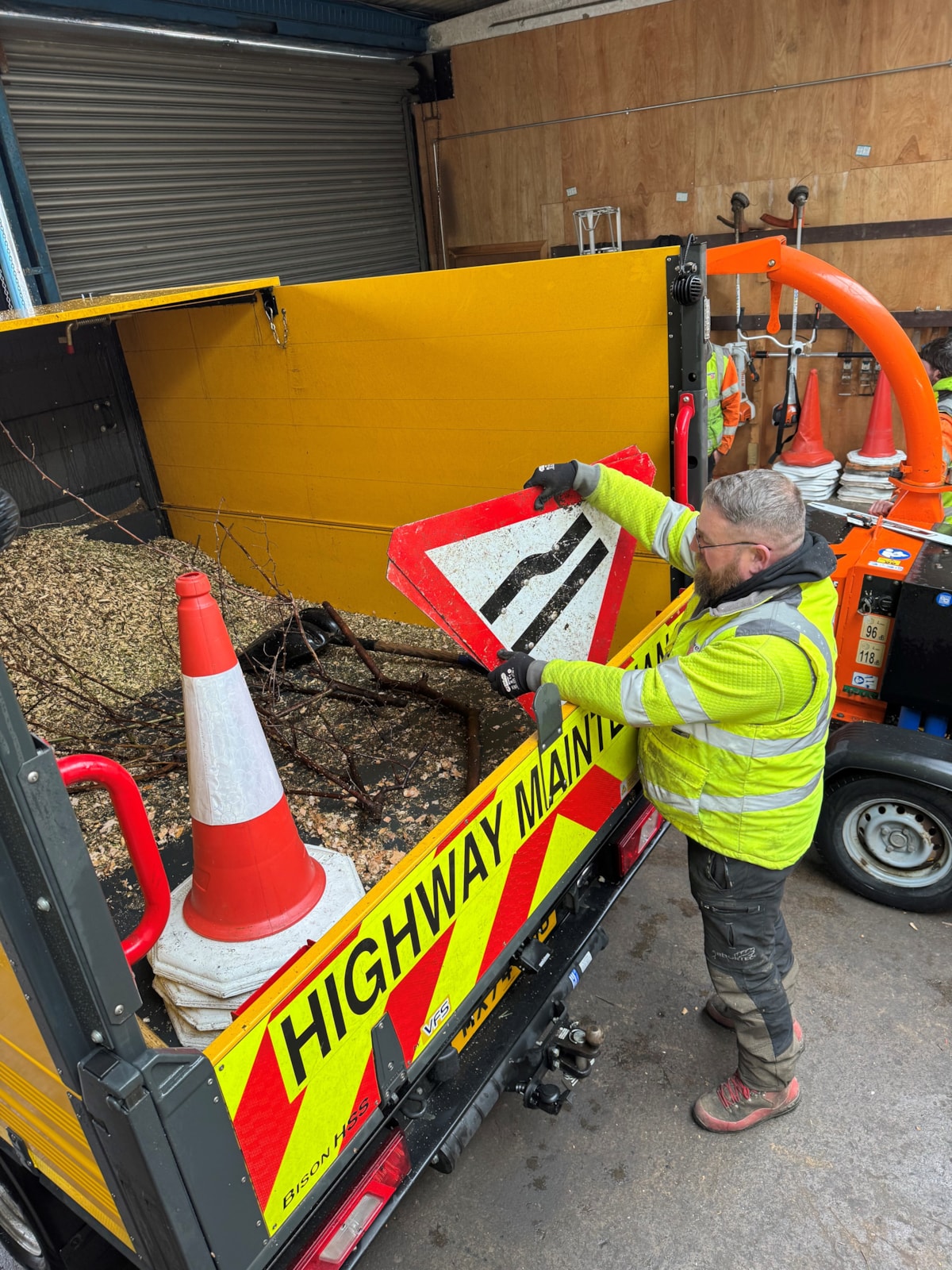 Arborists in LCC's highways team prepare for the storm by putting signs in a van