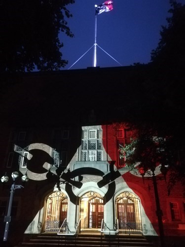 Council house lit up with Black Country flag