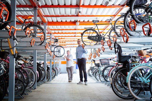 TfL Press Release - TfL announces £2.5m funding boost to meet growing demand for cycle parking: TfL Image - Will Norman and Cllr Clyde Loakes at a cycle parking hub in Walthamstow 01