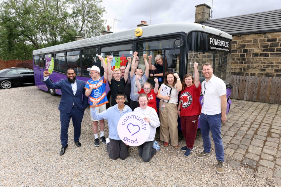 Mubs Mahmed (left) and driver trainer Debbie celebrate with teachers and students