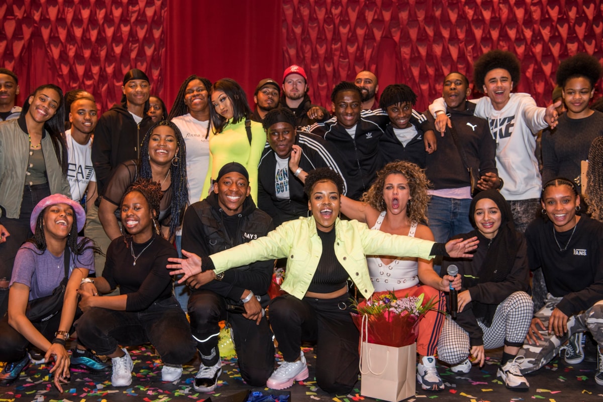 Angelia front with other contestants backstage