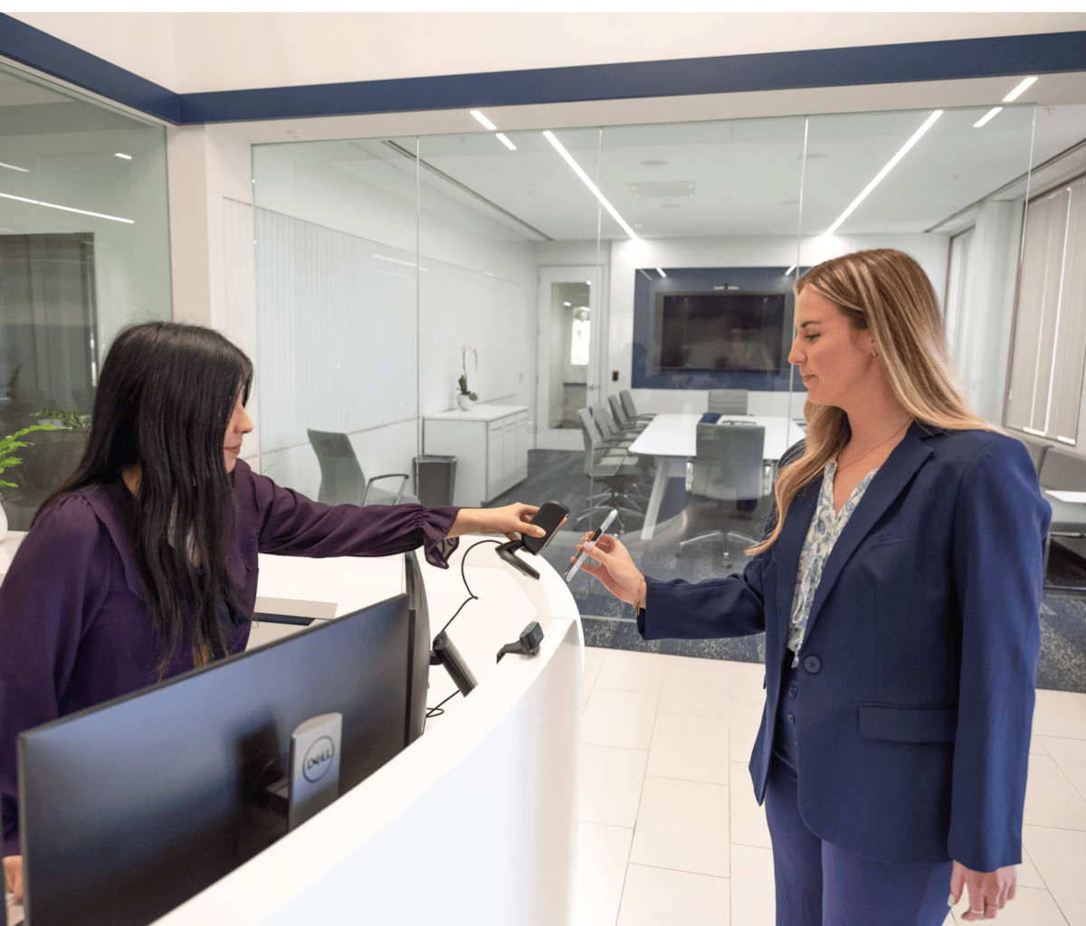 women trying to get into a building by scanning ID