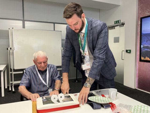 Ben Bryan, Network Rail operations manager, cuts the cake