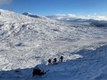 Carrying materials for the exclosures uphill to the planting site ©Natalie Ward/NatureScot