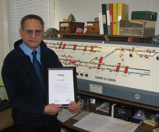 Dali Jabbar retirement: Dali Jabbar receives his retirement certificate at Thorpe-le-Soken signal box