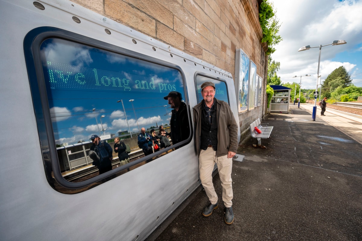 Award-winning artist, Rob Mulholland, with Hope in Hamilton art installation he developed with local community