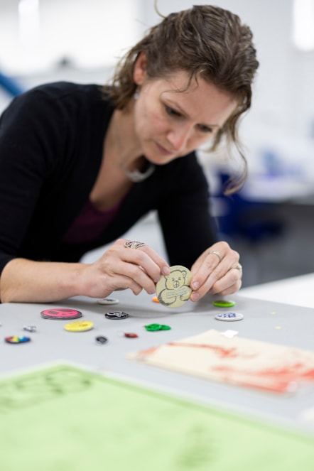 Lydia Messerschmidt, Artefact Conservator at National Museums Scotland prepares 1980s protest badges for display. Image (c) National Museums Scotland (4)