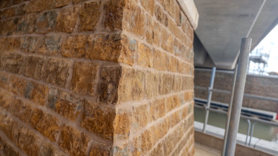 Close-up view of the ironstone caldding on one of the piers supporting the Oxford Canal viaduct Sept 2026