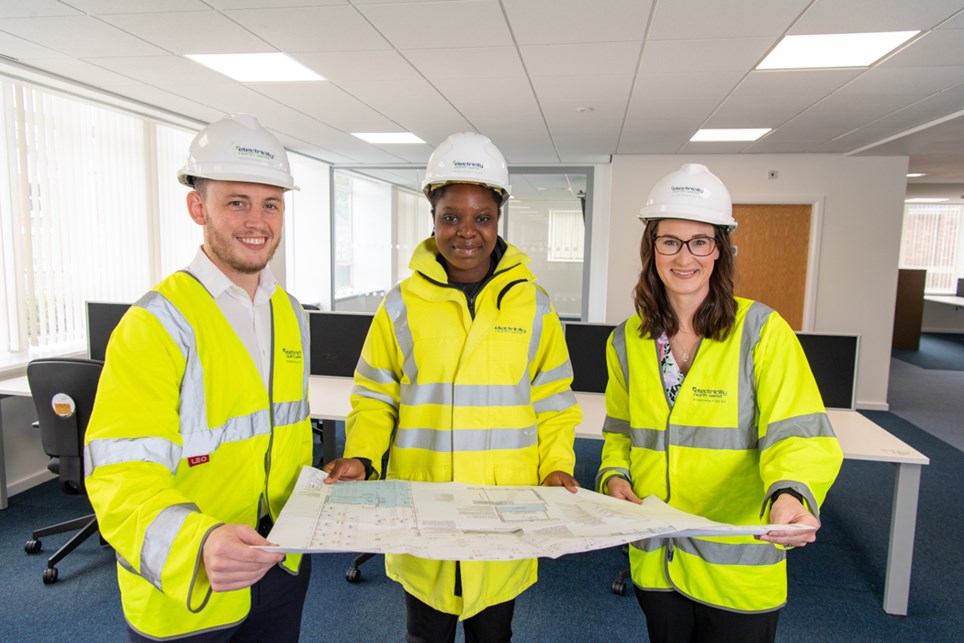 Pracious Nkume, centre, with Thomas Sims and Amy Jones 