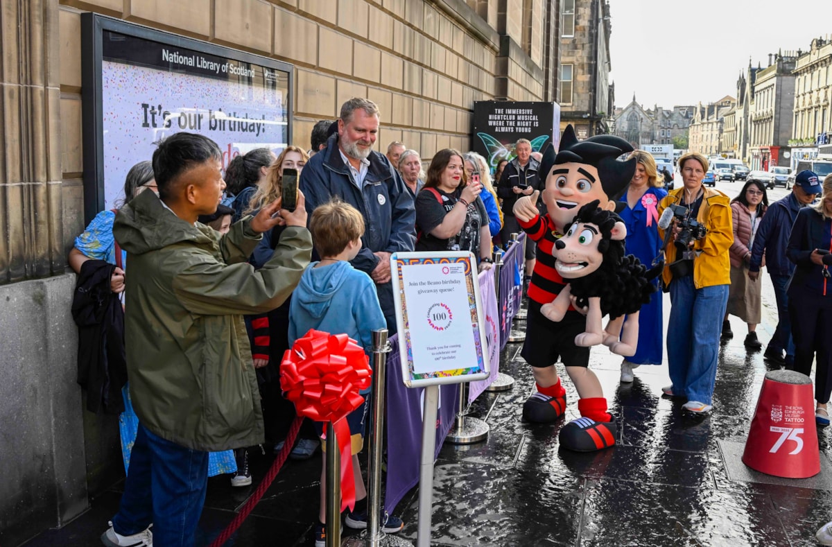 Beano fans queue outside the National Library of Scotland's George IV Bridge building. The Library was giving away special centenary editions of the comic to mark the Library's 100 birthday, which fell on 7 August. Credit: Neil Hanna