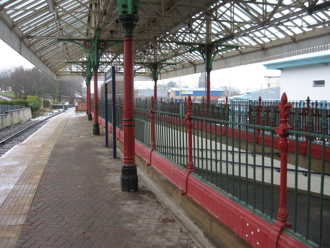 Subway railings (before): Railings surrounding the slope up to the platform.