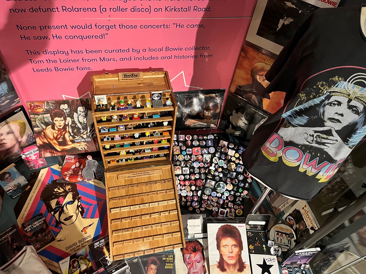 Bowie display at Leeds City Museum: The new display at Leeds City Museum features an incredible array of objects spanning decades of Bowie’s unique life, all painstakingly collected by a local super fan and kindly loaned to the museum.
Taking pride of place is a handmade cabinet filled with specially created Lego figurines, each one capturing in minute detail one of the many changing faces adopted by the iconic singer, songwriter and actor, who sold an estimated 140 million albums worldwide during a trailblazing career.