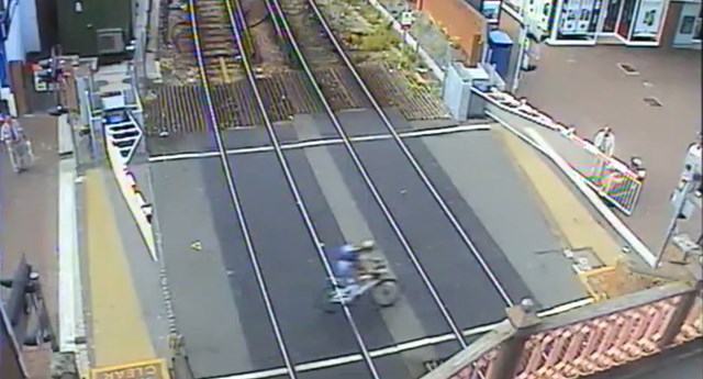 Poole High Street level crossing cyclist