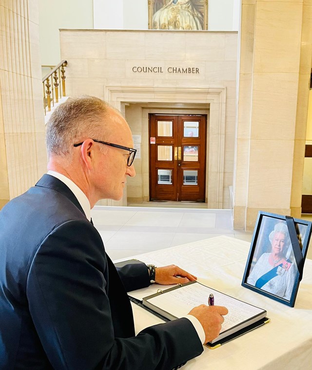 Cllr Richard Roberts, Leader of Hertfordshire County Council, signing the Book of Condolence at County Hall