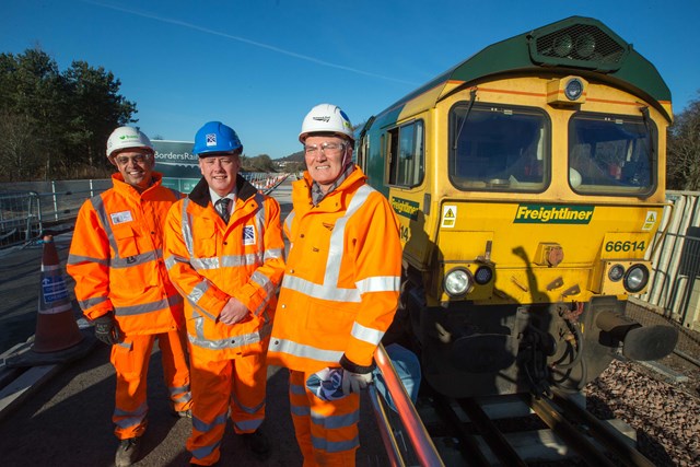 Borders final rail installation: Infrastructure Secretary Keith Brown (Centre) with Hugh Wark, Network Rail project director for the Borders Railway, and Nissar Mohammed of main contractor BAM.
