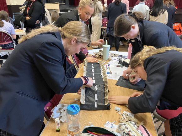 Students at The Mount School constructing their bridge design at a Network Rail STEM day for IWD 2