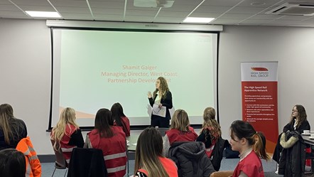 Shamit Gaiger speaking to young female apprentices