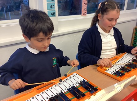 Adelaide Primary Schoolchildren playing music instruments after receiving their grant from TPE