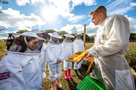 Pupils from The Radstone Primary School on the HS2 site with bee hives