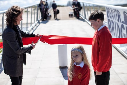 Cabinet Secretary Mairi Gougeon MSP cutting the ribbon with Aiden Ingram and Lola Thomson from St Gerardine Primary School