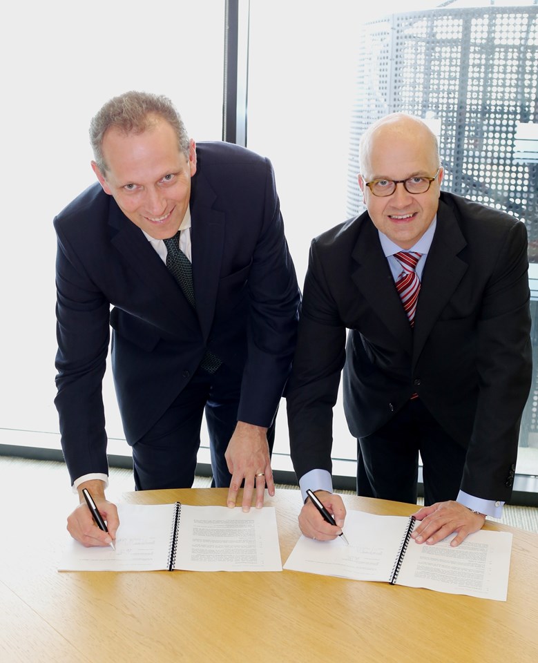 New rail supply deal signed with Tata: Network Rail's finance director Patrick Butcher and Tata Steel's Gérard Glas sign the contract