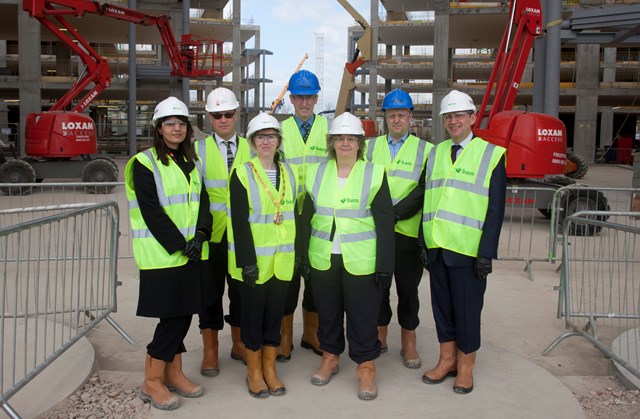 National centre, 12 April 2011: Network Rail chief executive (blue hat, centre) is joined by guests including the mayor of Milton Keynes on a tour of the National Centre. This group is standing on what will be the main entrance to the building