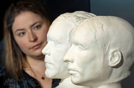 Curator Sophie Goggins with the life masks of mass murderers Burke and Hare, on loan from the Anatomical Museum collection, University of Edinburgh. Photo © Neil Hanna