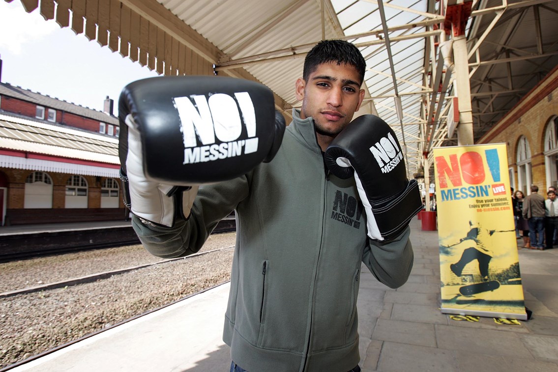 Amir Khan joins No Messin'! campaign: Amir Khan at Bolton station