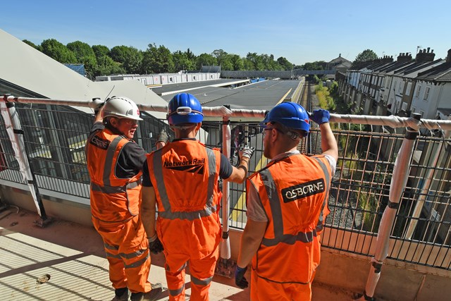Engineers having team briefing at Twickenham station