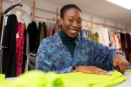 A Fashion Enter employee works on a garment at their Fonthill Road premises