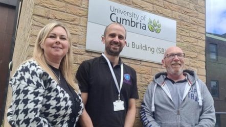 A woman and two men stood in front of a University of Cumbria sign to mark the partnership between the university and Manx Care