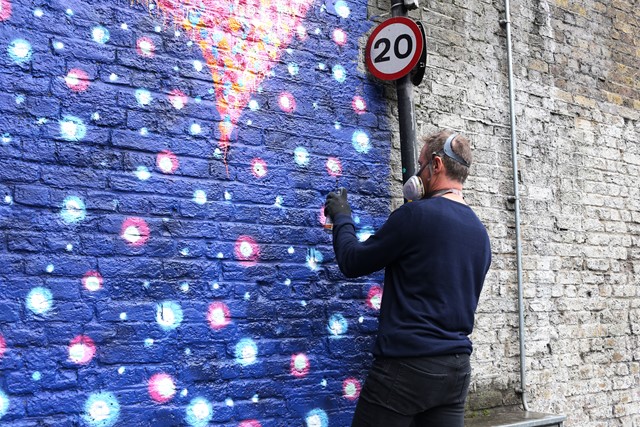 Jimmy C working on his artwork in Southwark: Jimmy C working on his artwork in Southwark - the wall to the left is what it looked like before