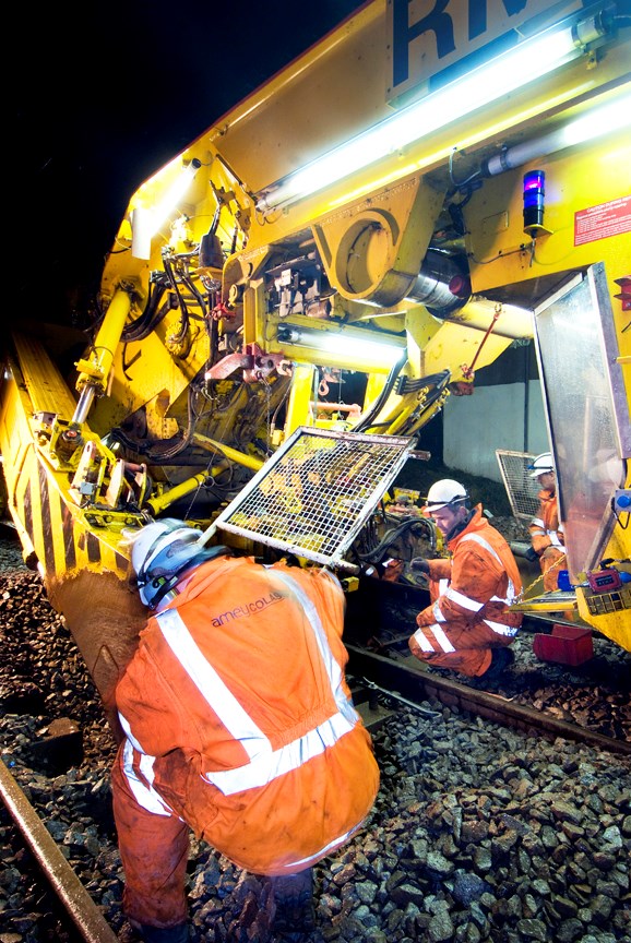 Network Rail's high output Track Renewal System 4 in action with AmeyCOLAS staff