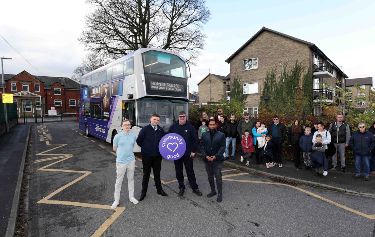 First Bus team and families meet out side the school