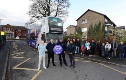 First Bus team and families meet out side the school